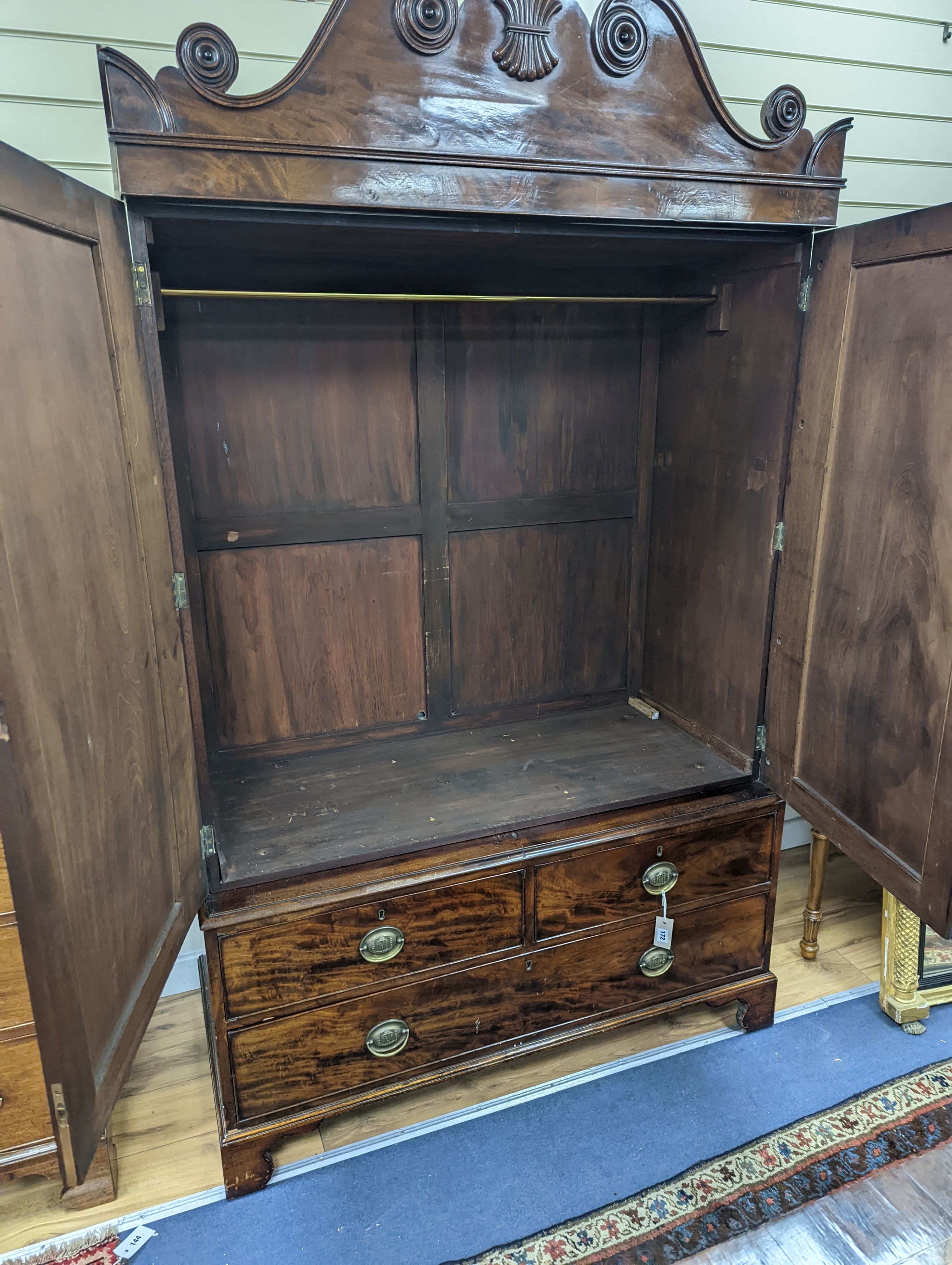 A William IV mahogany hanging cupboard, converted from a linen press, width 120cm, depth 57cm, height 204cm